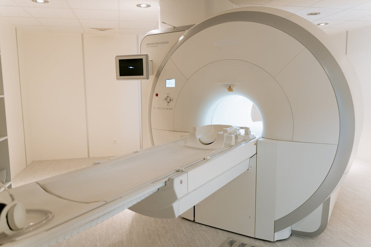 heros-img A state-of-the-art MRI scanner in a well-lit hospital room, ready for patient use.